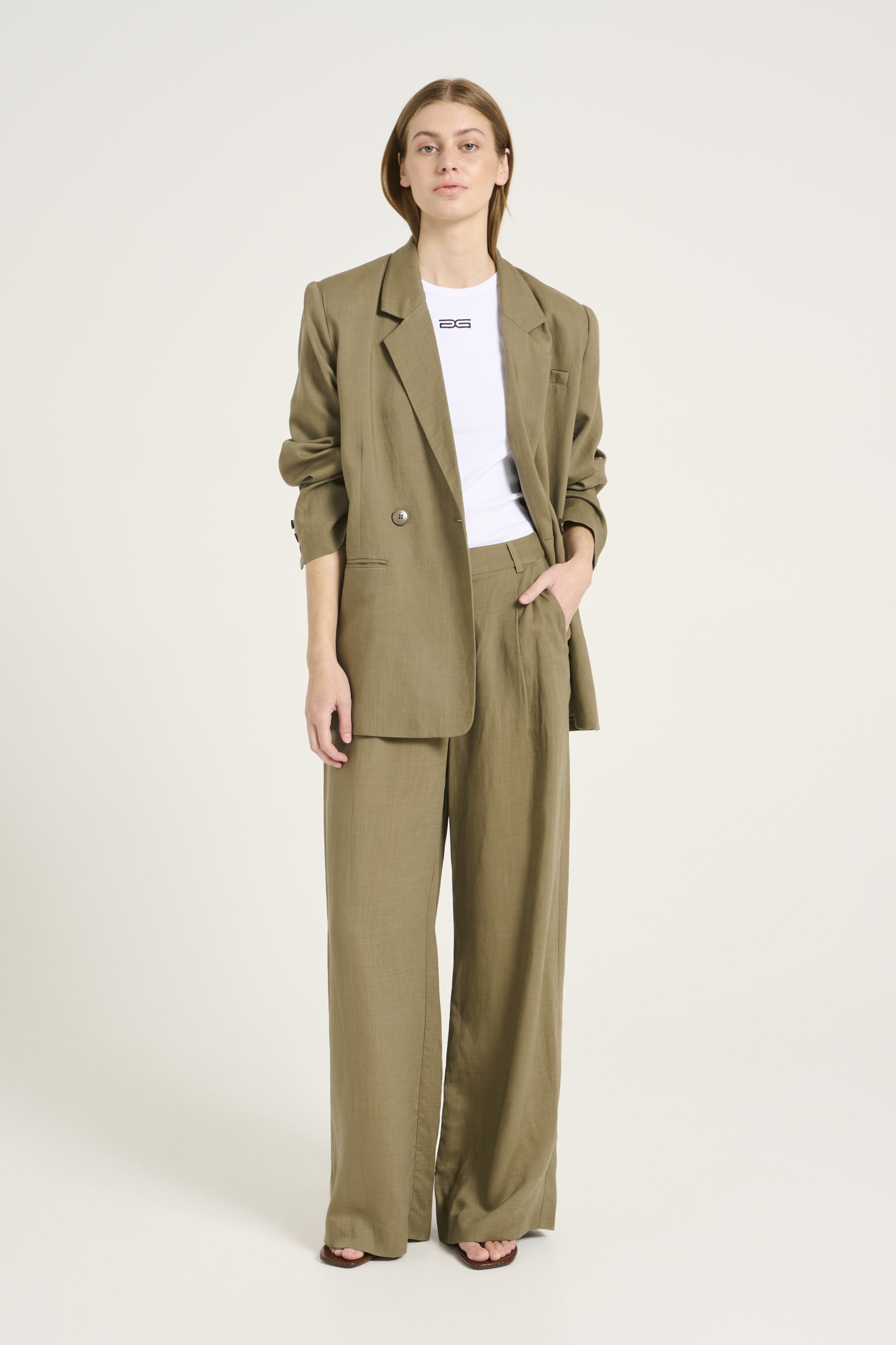 GOBELIN-STYLE JACQUARD 2-TUCK TAPERED PANTS WITH FRINGE HEM